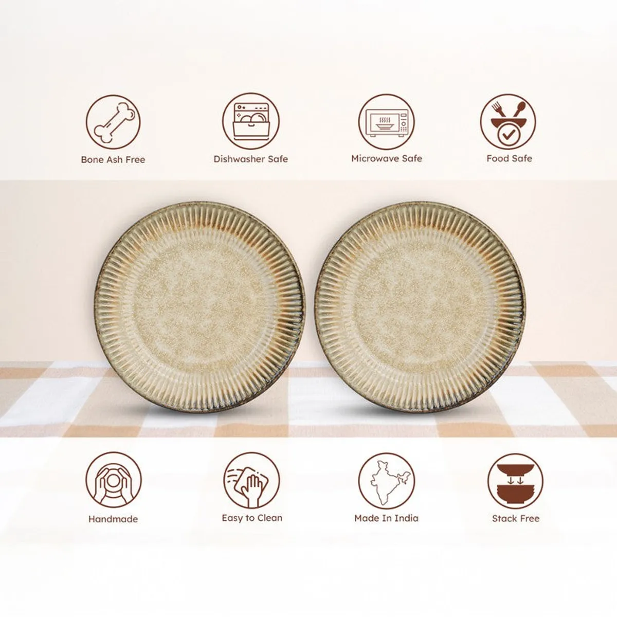 Two beige ceramic plates displayed on a checked tablecloth
