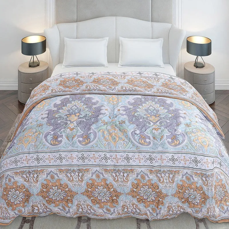 Front view of an ornate multicolour ethnic print duvet cover on a bed