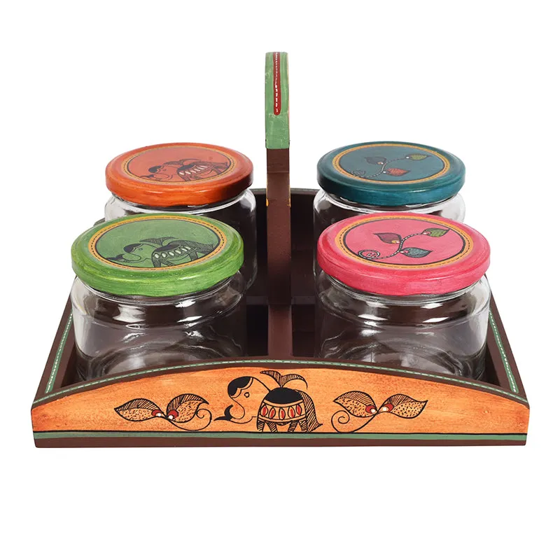 Front view of four decorative jars arranged in a brown tray with colourful lids.