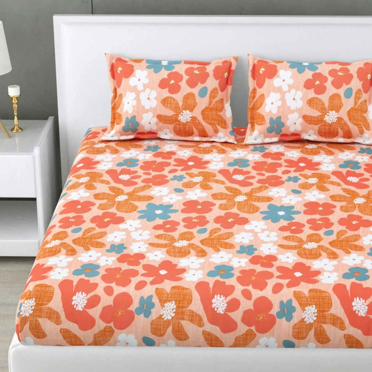 Close-up view of the oversized multicolour floral bedsheet pattern.