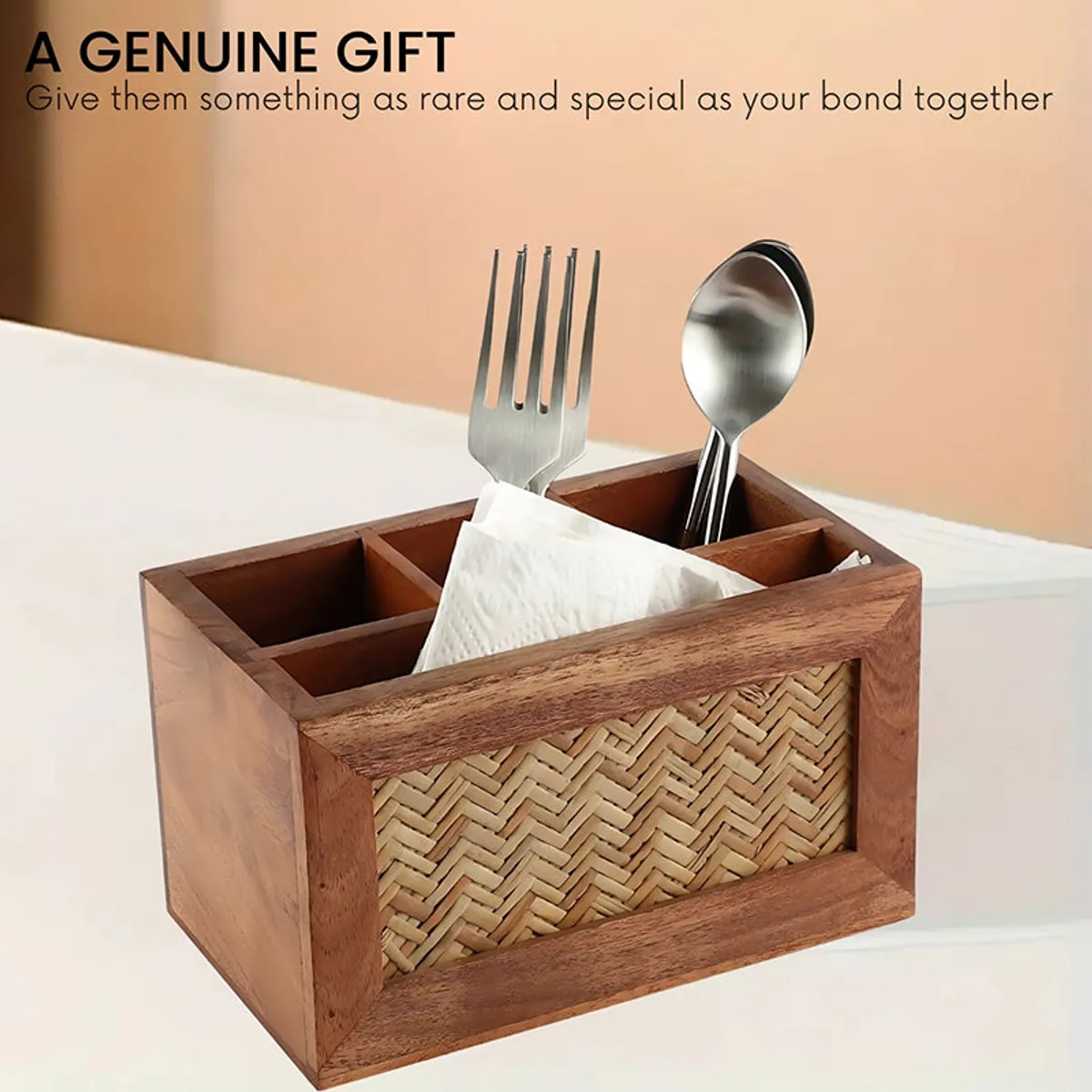Wooden cutlery holder with cutlery and napkins styled on a dining surface