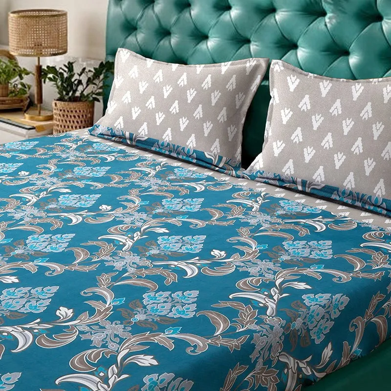 Detailed view of blue ethnic floral bedsheet with matching grey pillow covers