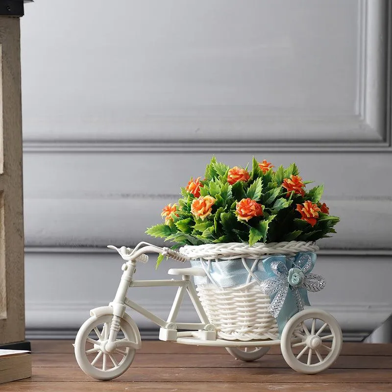 Faux Orange Rose Plant On Cycle Rikshaw media 1