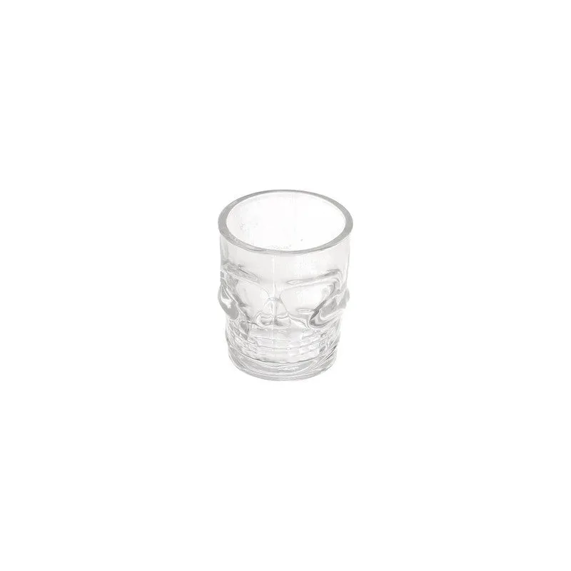 Single clear skull-shaped shot glass on a white background
