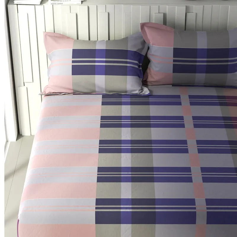 Close view of purple and peach geometric bedsheet pattern