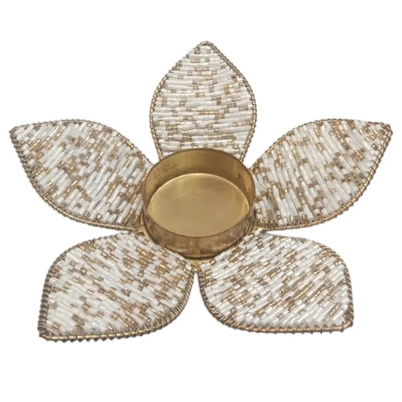 Close-up of the multicolour beaded metal petal tea light holder