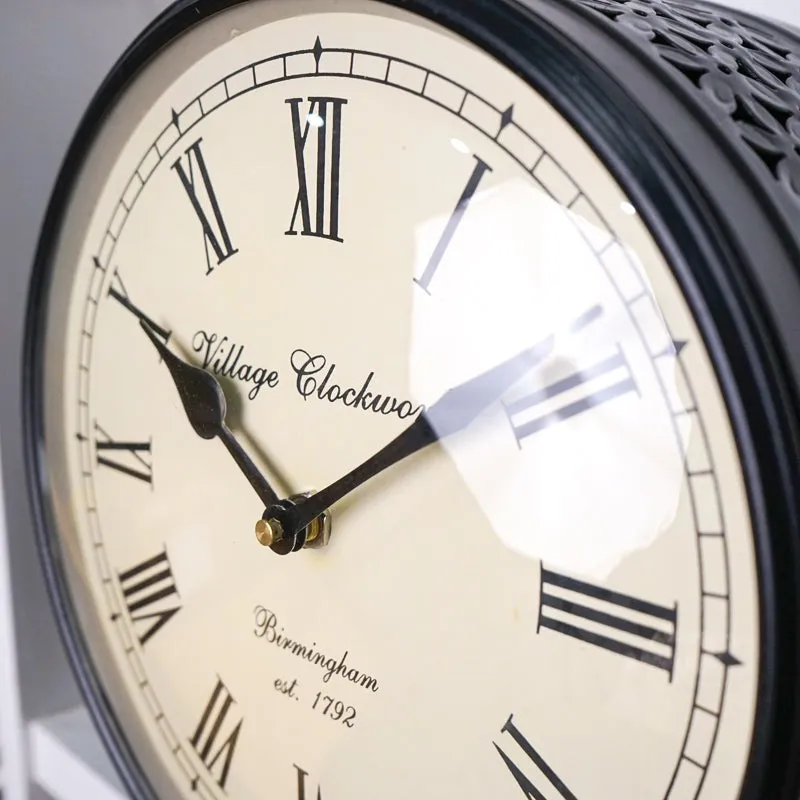 Close-up view of the clock face showing Roman numerals and black hands.