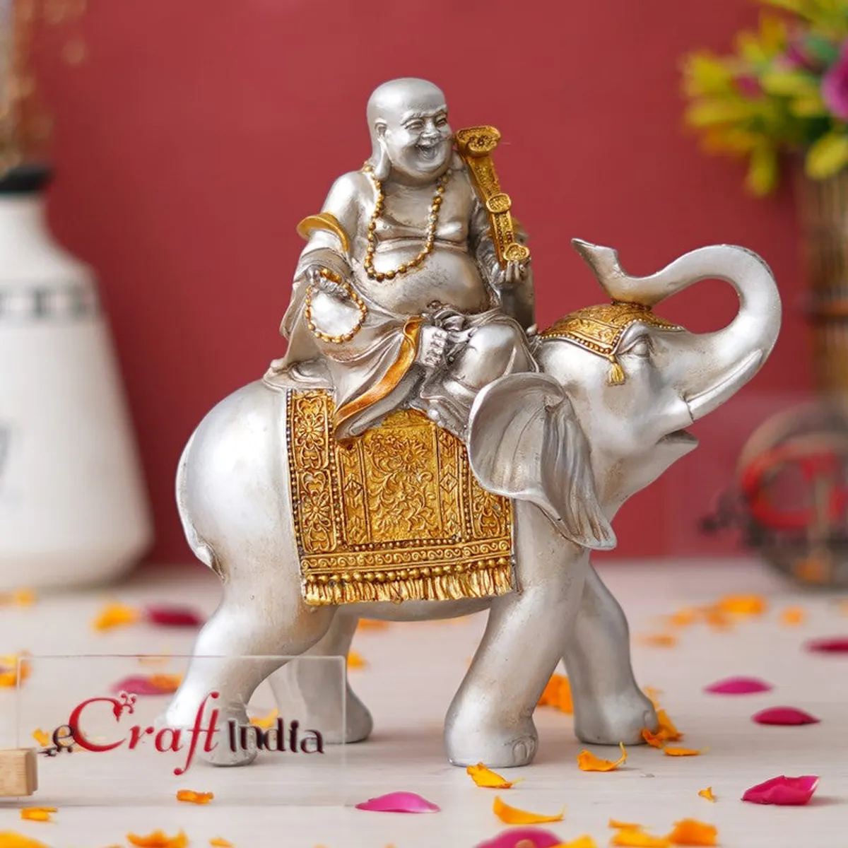 Front angled view of decorative silver and gold figurine