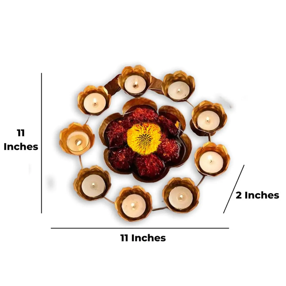 Gold urli with diya holders shown with flowers and candles, top view