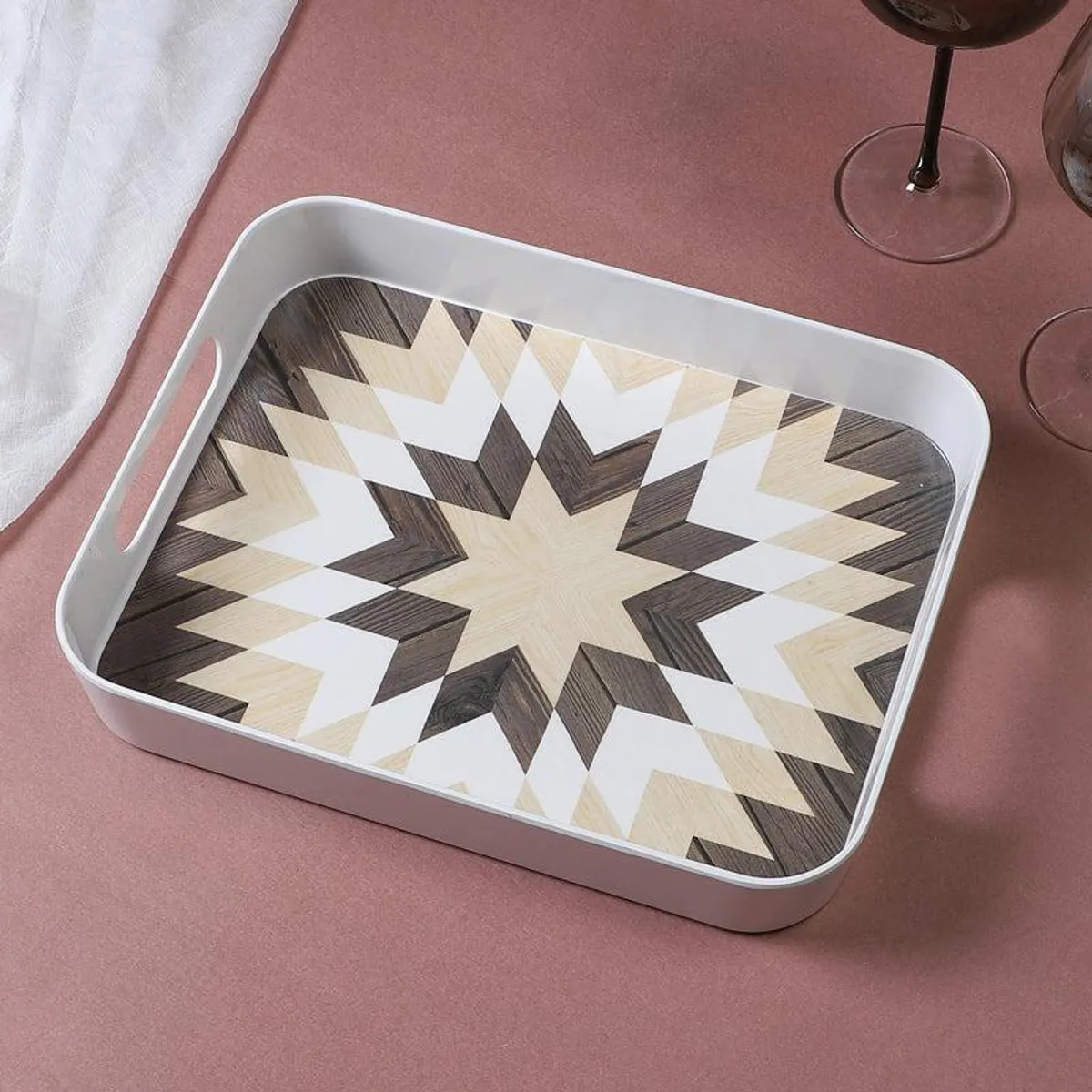 Close view of a white rectangular tray with a geometric star design