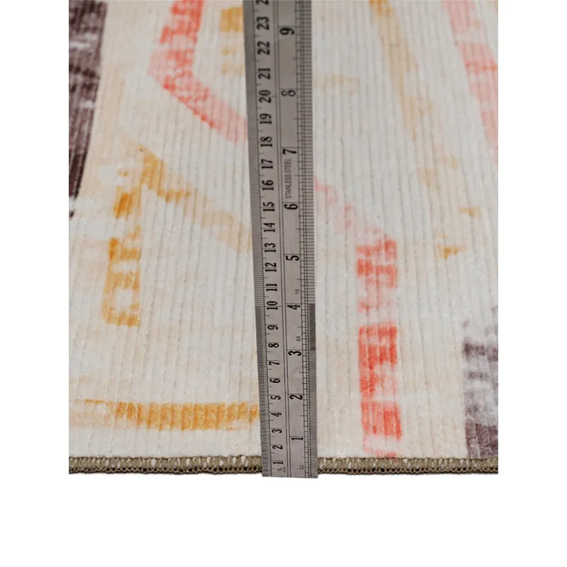 Close-up of the carpet surface with a ruler placed vertically
