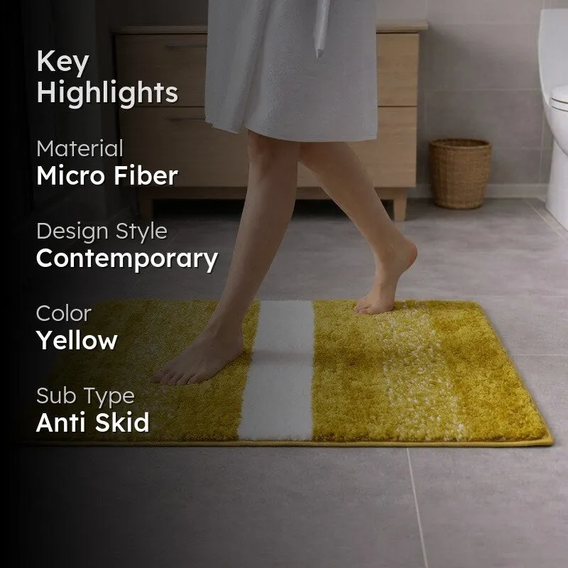 Yellow rectangular bath mat in a bathroom setting