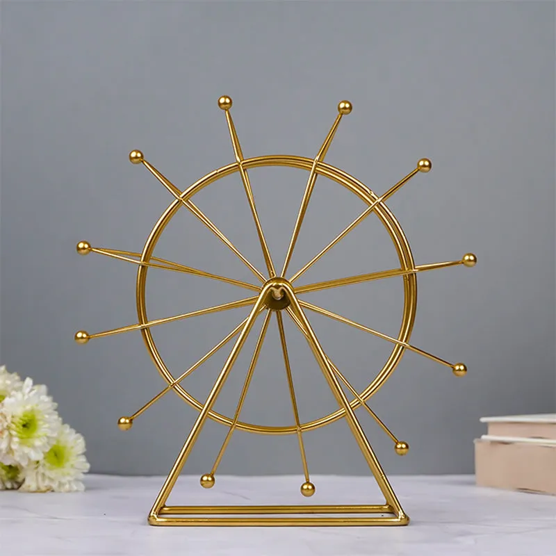 Front view of a gold Ferris wheel showpiece on a tabletop