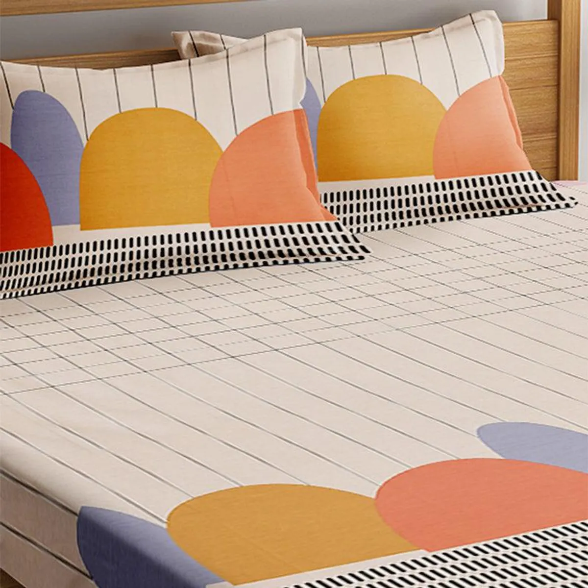 Geometric bedsheet styled on a bed with colourful arches and grid lines