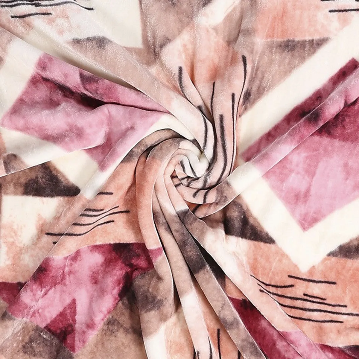 Close-up of blush geometric blanket fabric with black linear details