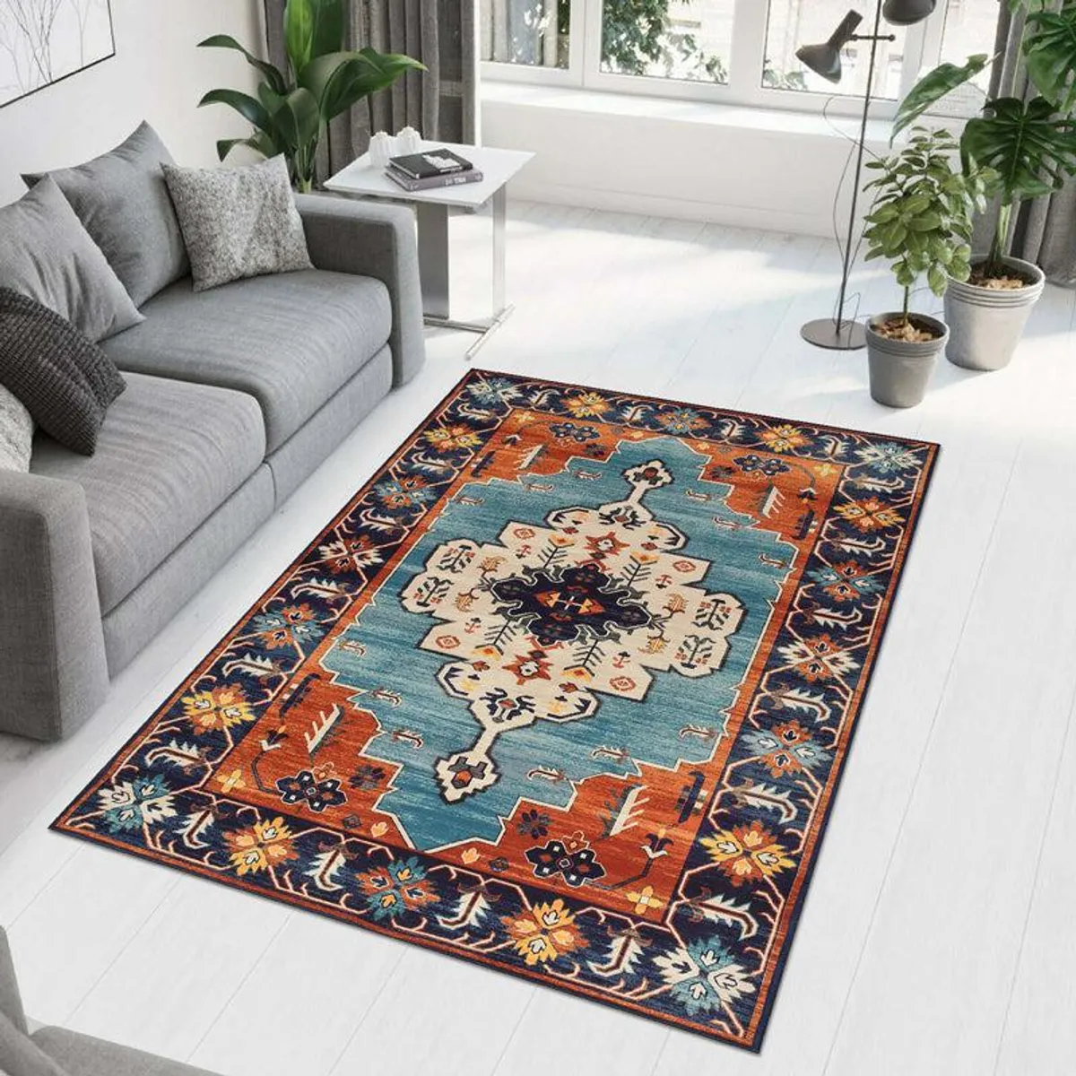 Rectangular multicolour ethnic-pattern carpet styled beside a grey sofa in a bright living room