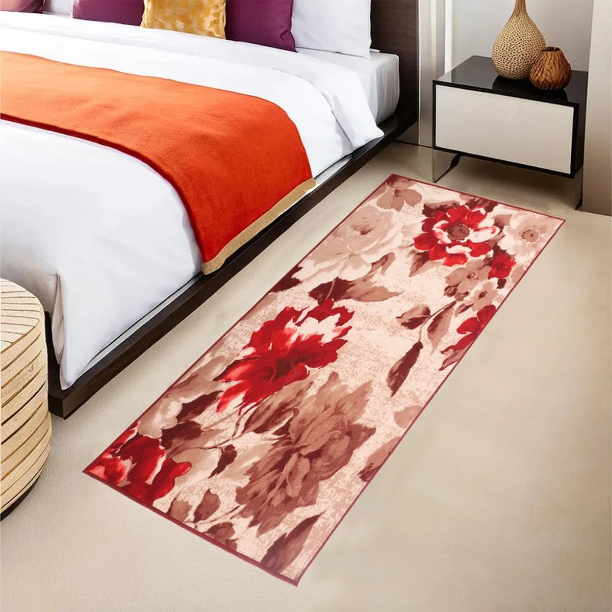 Beige and red floral runner rug placed beside a bed