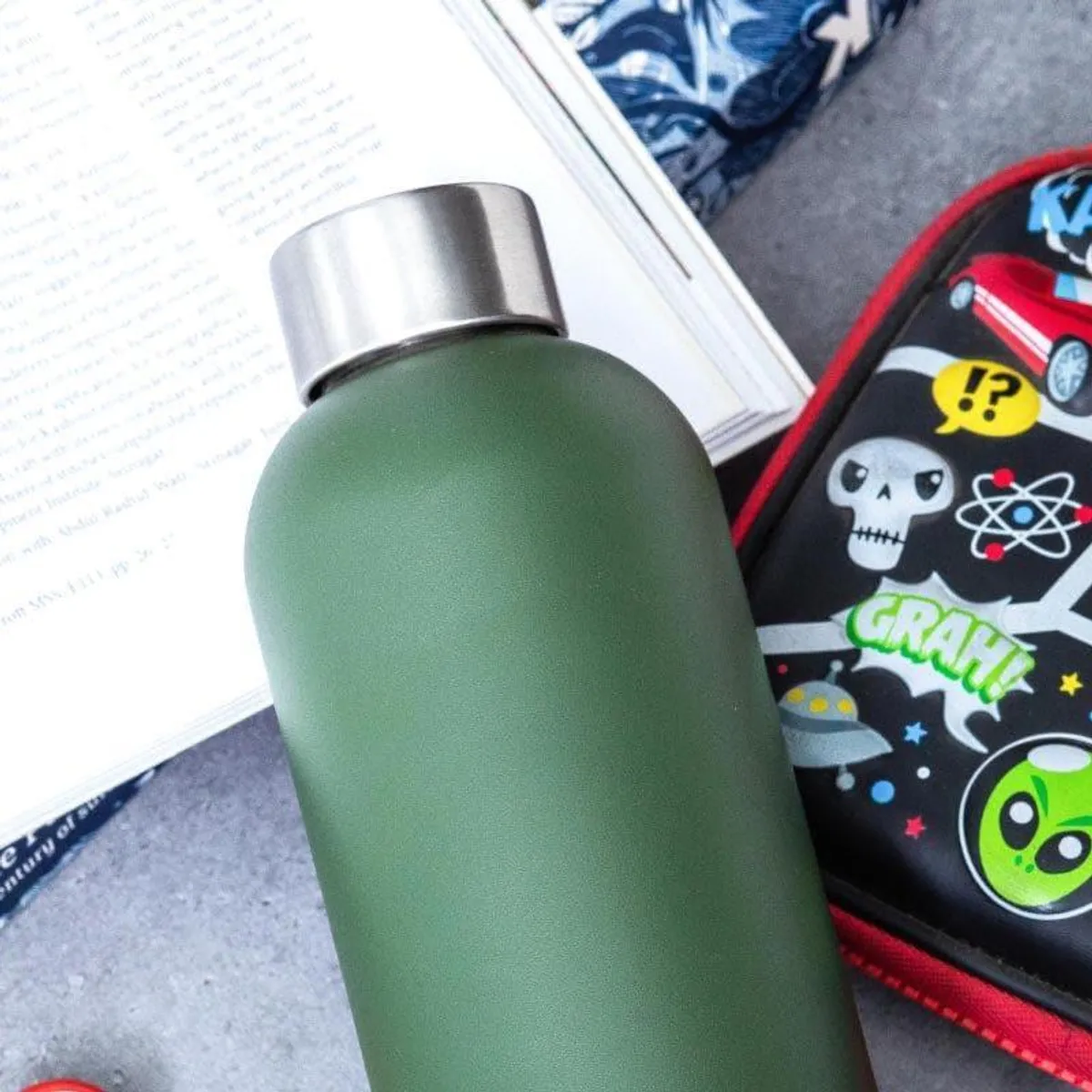 Close-up view of the bottle's matte green finish and silver cap