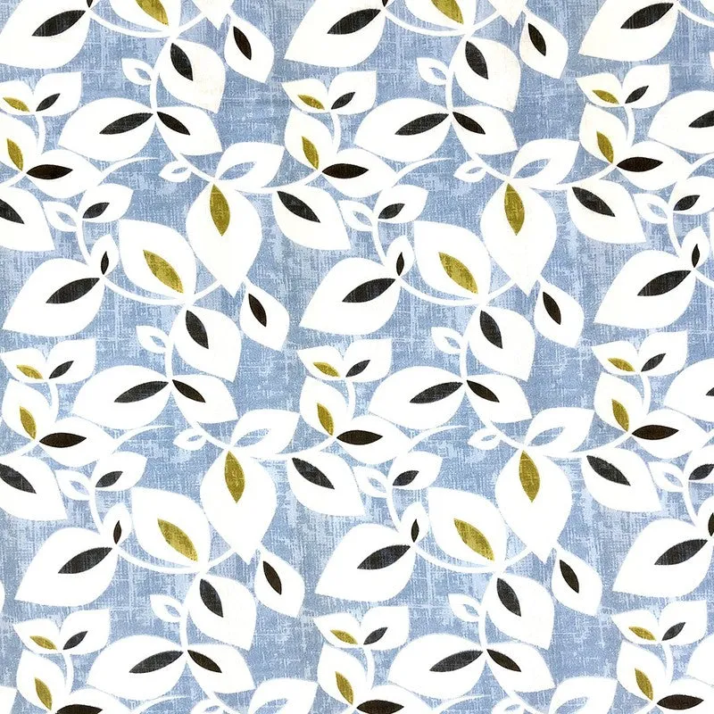 Close-up of blue textured bedsheet fabric with white and olive leaf motif