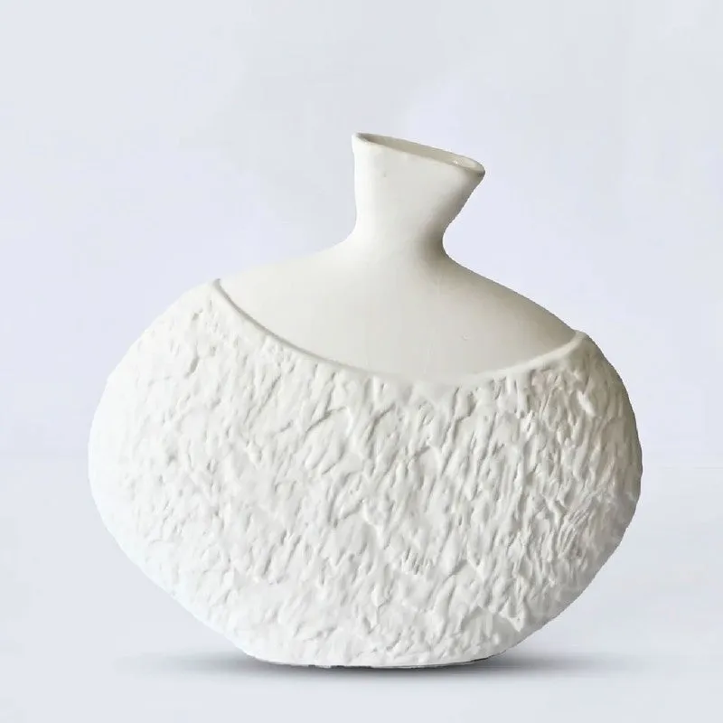 Front view of a white textured decorative vase against a plain background.