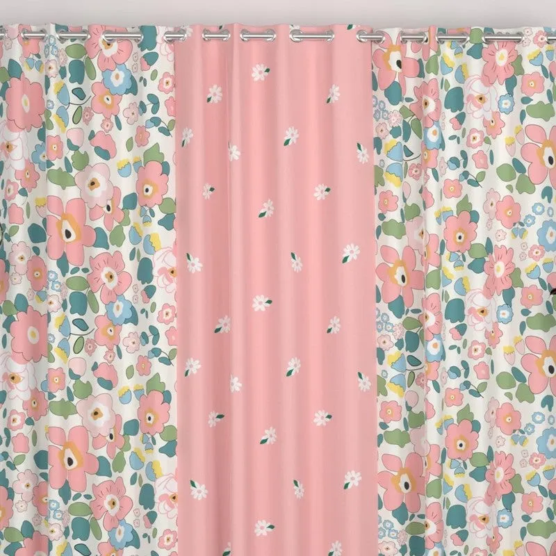 Close view of pink floral curtains with eyelet tops