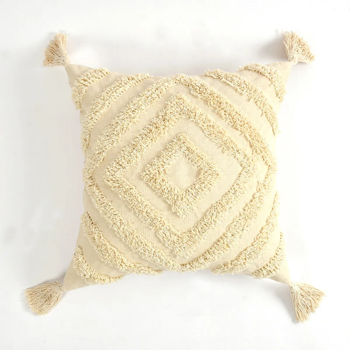 Front view of white square cushion cover with tufted diamond pattern and tassels