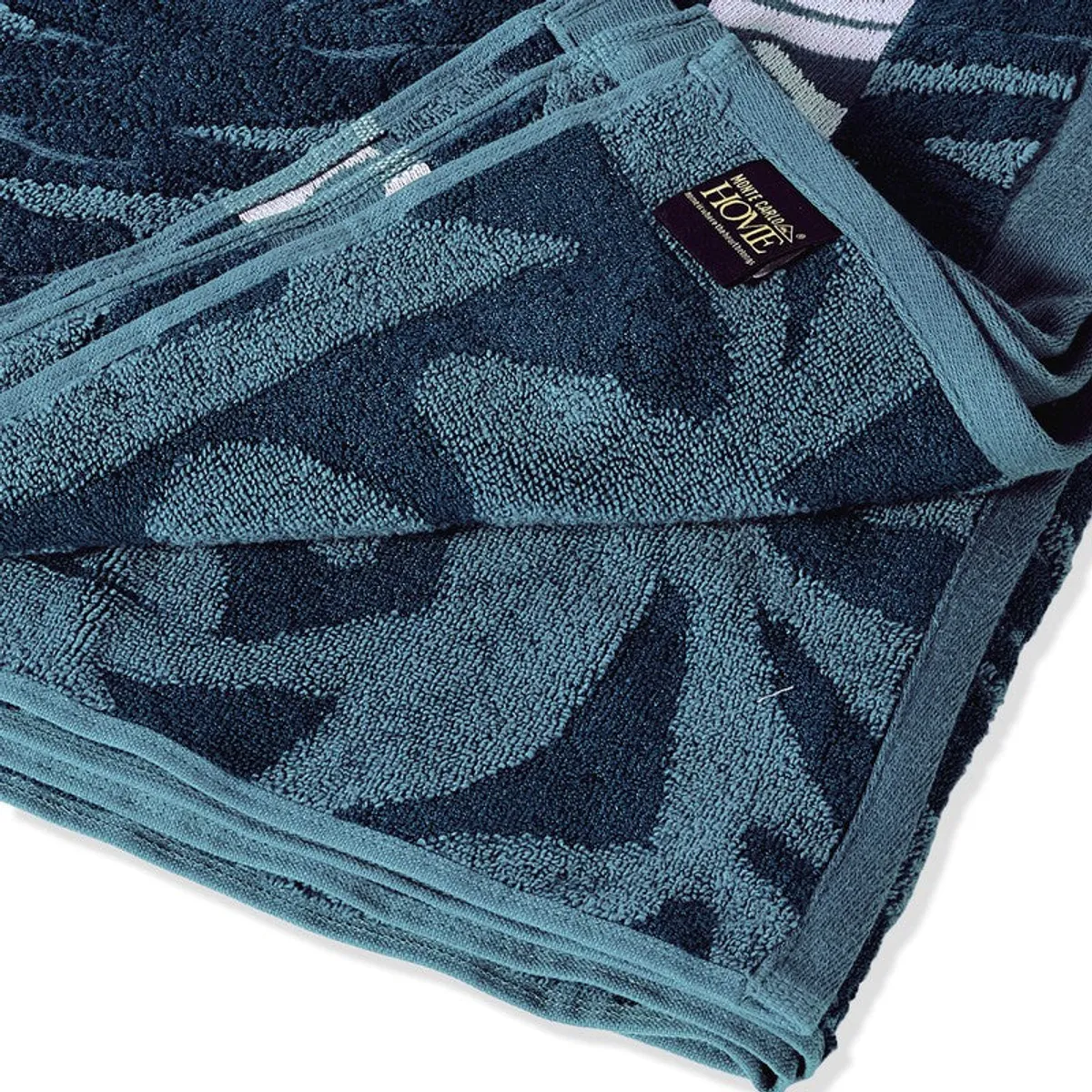 Close-up of the towel's blue textured fabric and patterned border