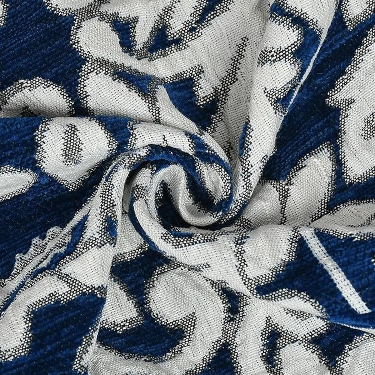 Close-up of blue and white patterned cotton chenille table cover texture