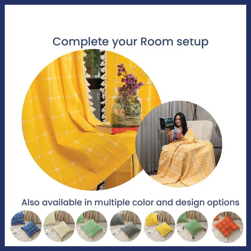 Yellow grid textile draped beside styled room decor with matching cushion shown
