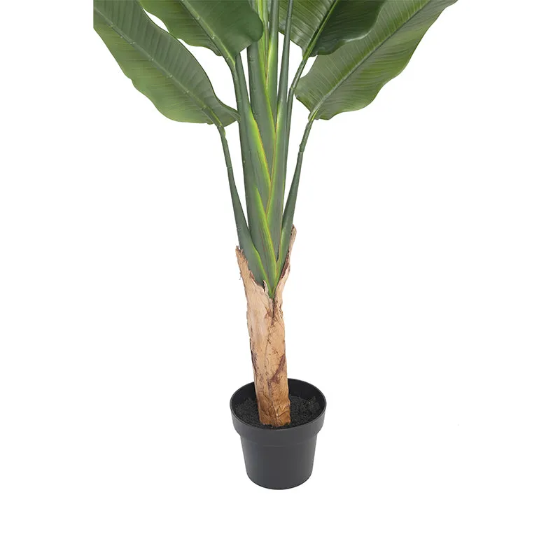Tall green artificial leaf plant in a black plastic pot