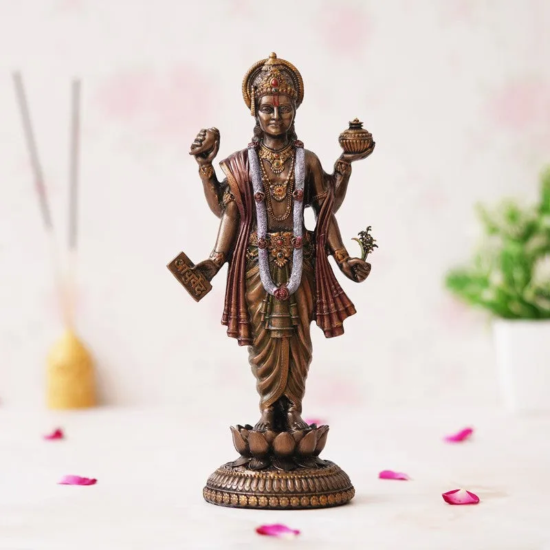 Bronze-toned Dhanvantari idol with detailed ornaments and lotus base