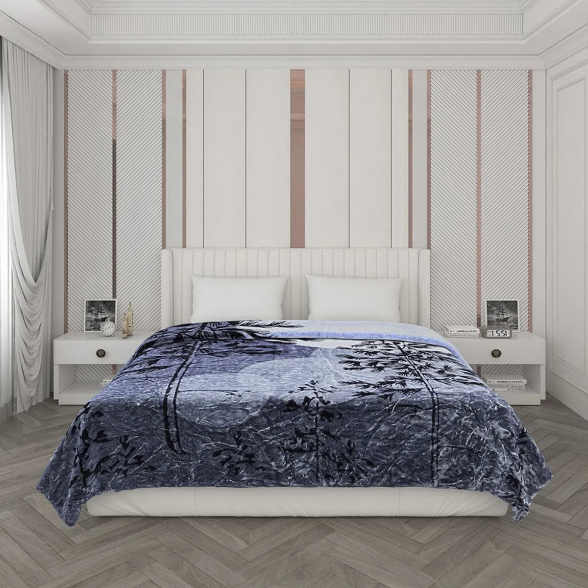 Blue printed botanical blanket covering a double bed