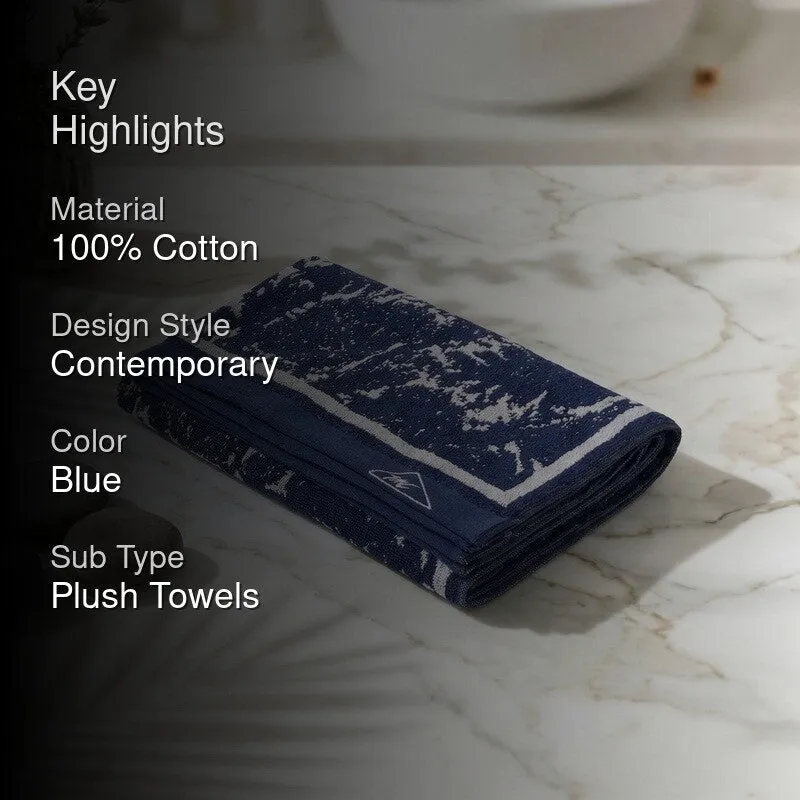 Blue and white folded bath towel with a key highlights overlay