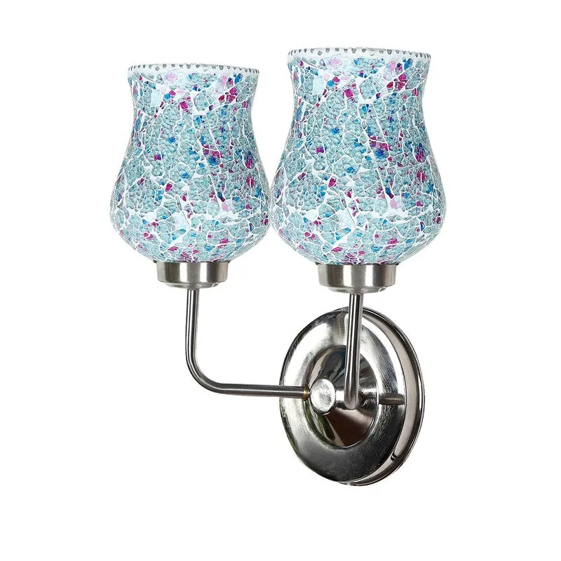 Angled view of blue crackle glass wall lamp with two shades