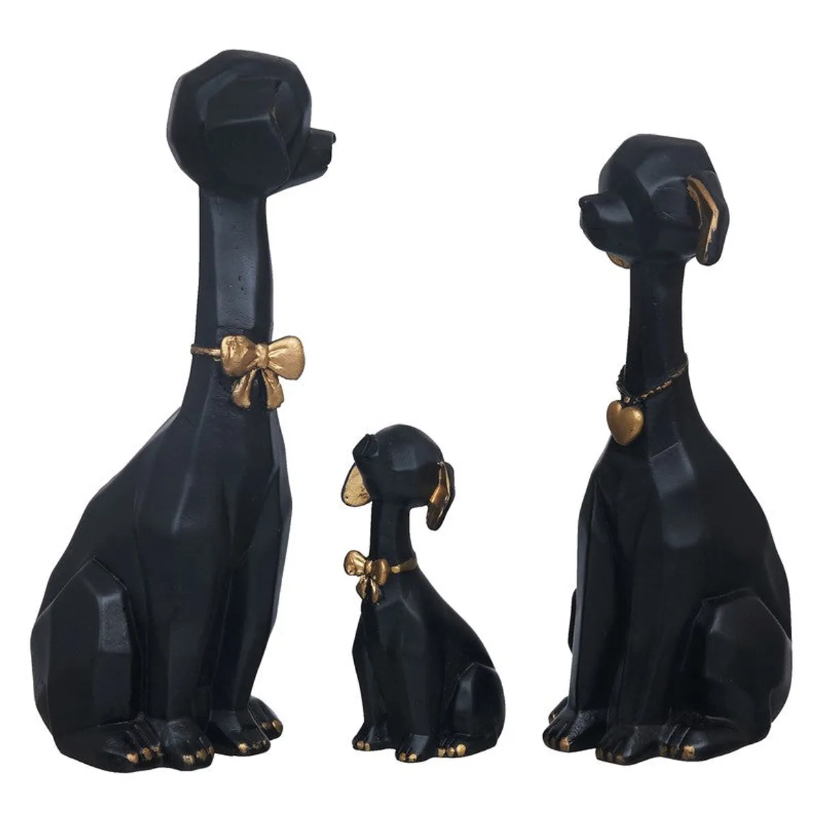 Side view of three black and gold dog figurines