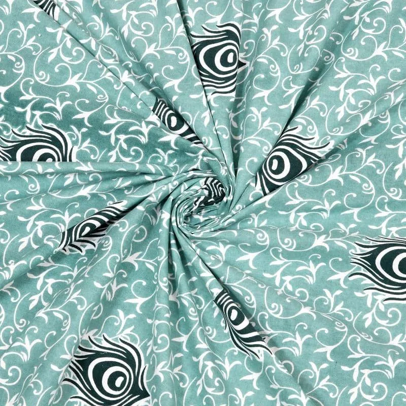 Close-up of green printed cotton fabric with white vine pattern