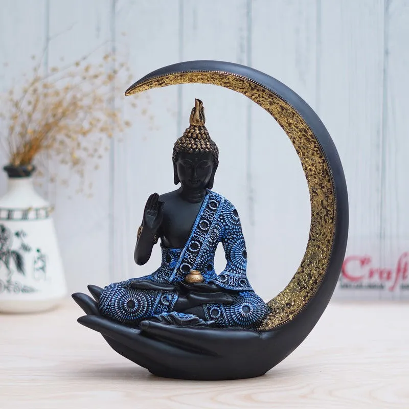 Front view of Buddha idol in black, blue and gold with crescent frame