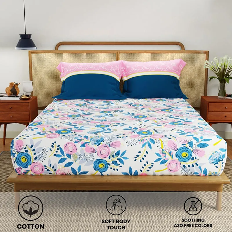 Wide view of floral bedsheet set styled on a wooden bed
