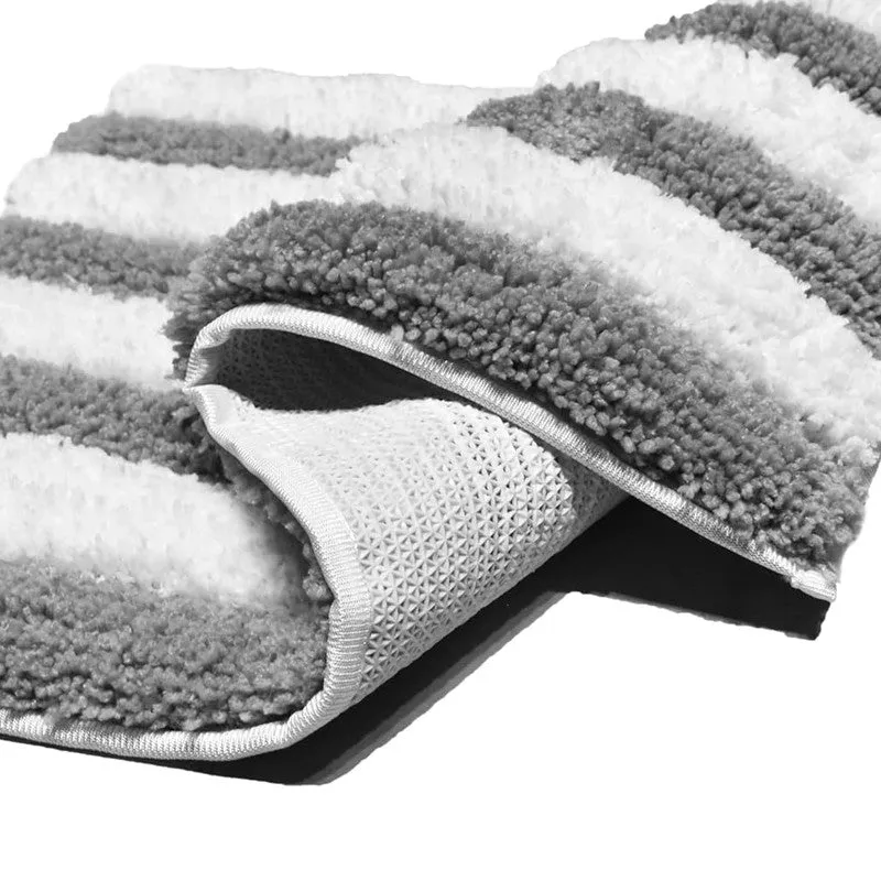Close-up of the bath mat showing plush striped texture and underside