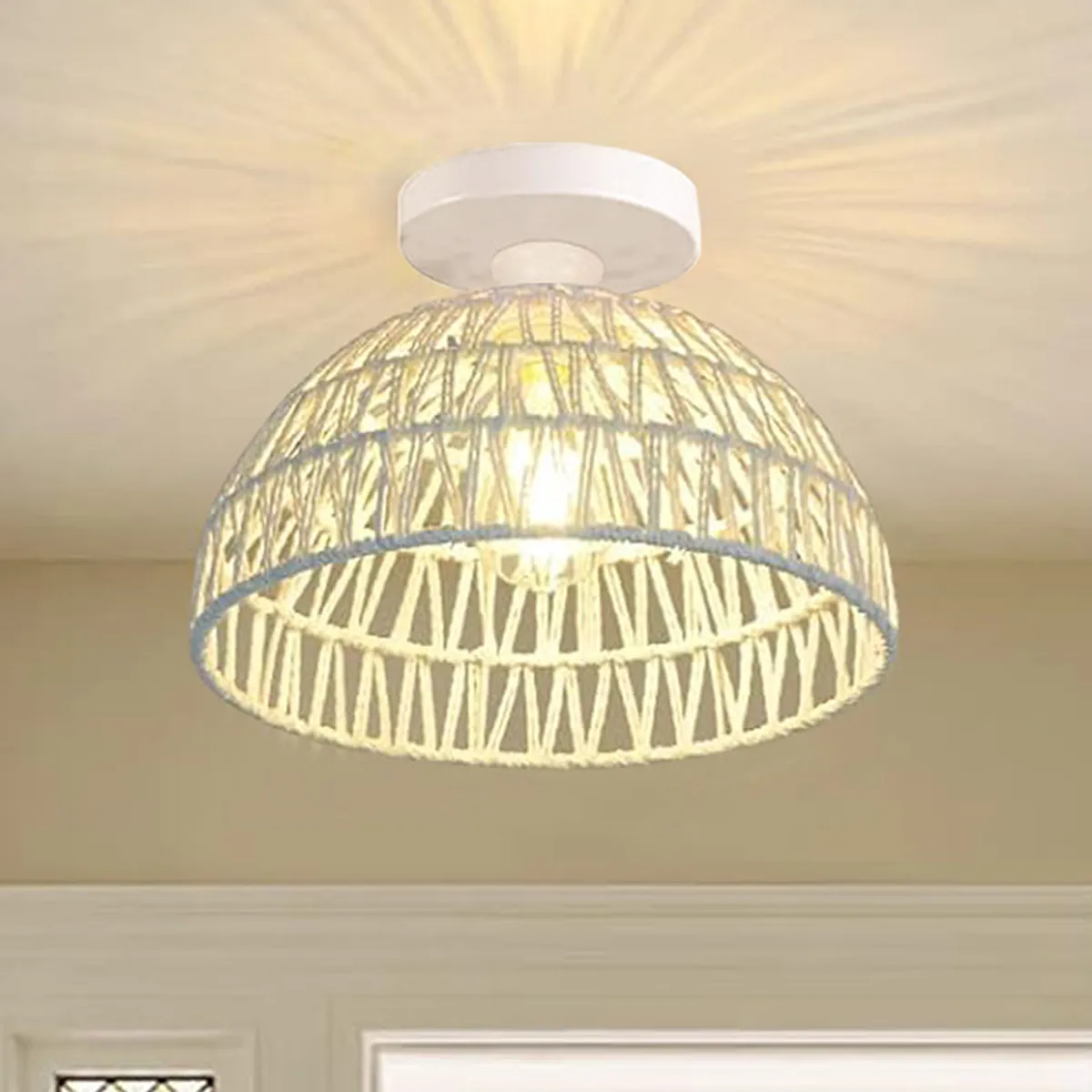 White dome ceiling lamp with an open lattice shade casting soft radial light
