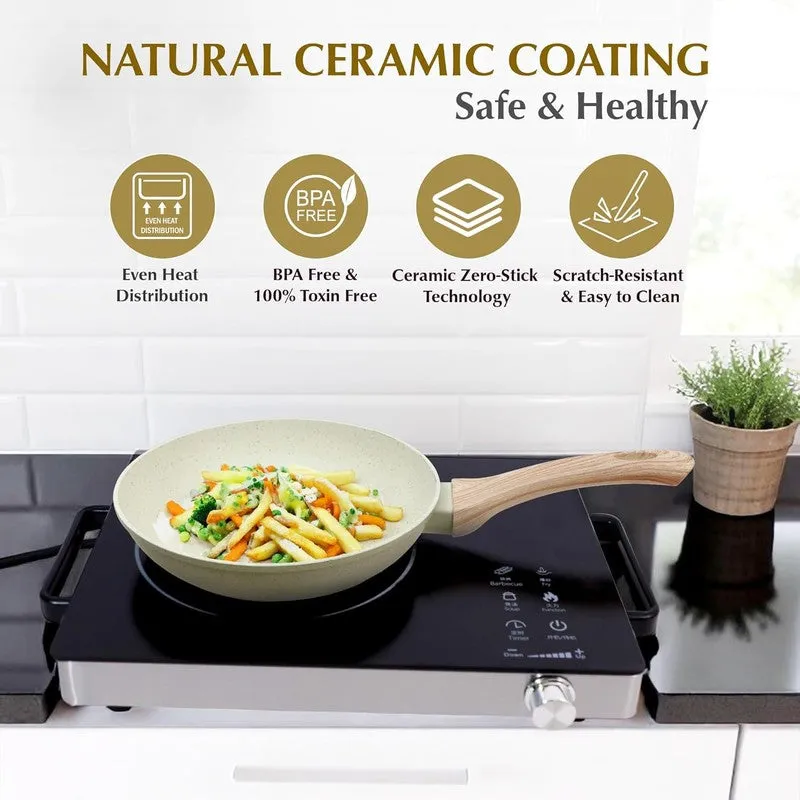 White speckled frying pan with wood-look handle on an induction cooktop