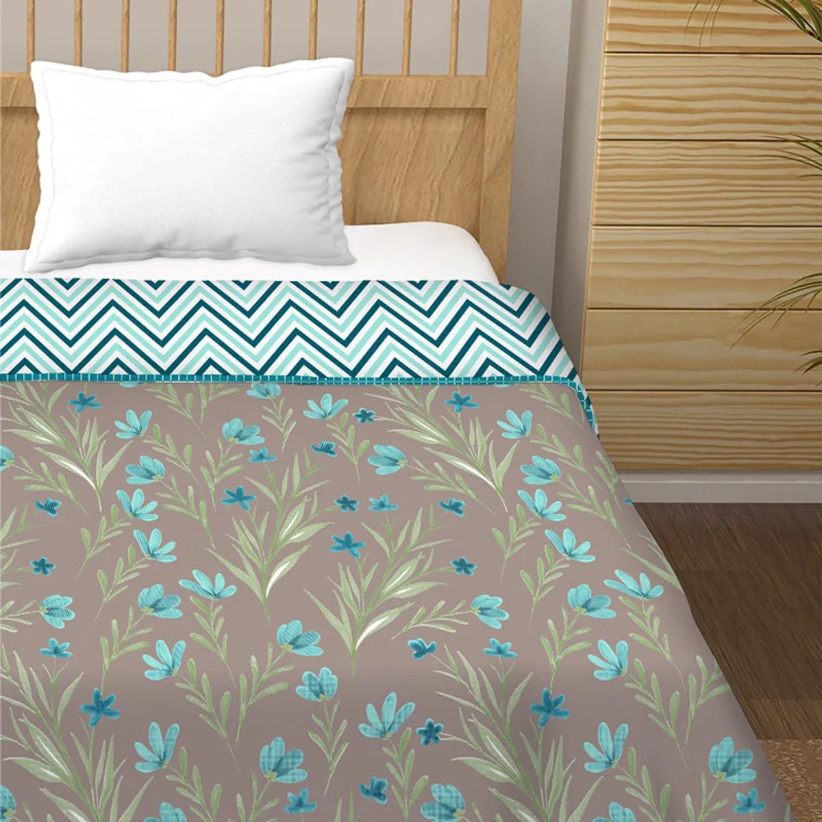 Close view of the floral blue and green dohar with its contrasting zigzag reverse.