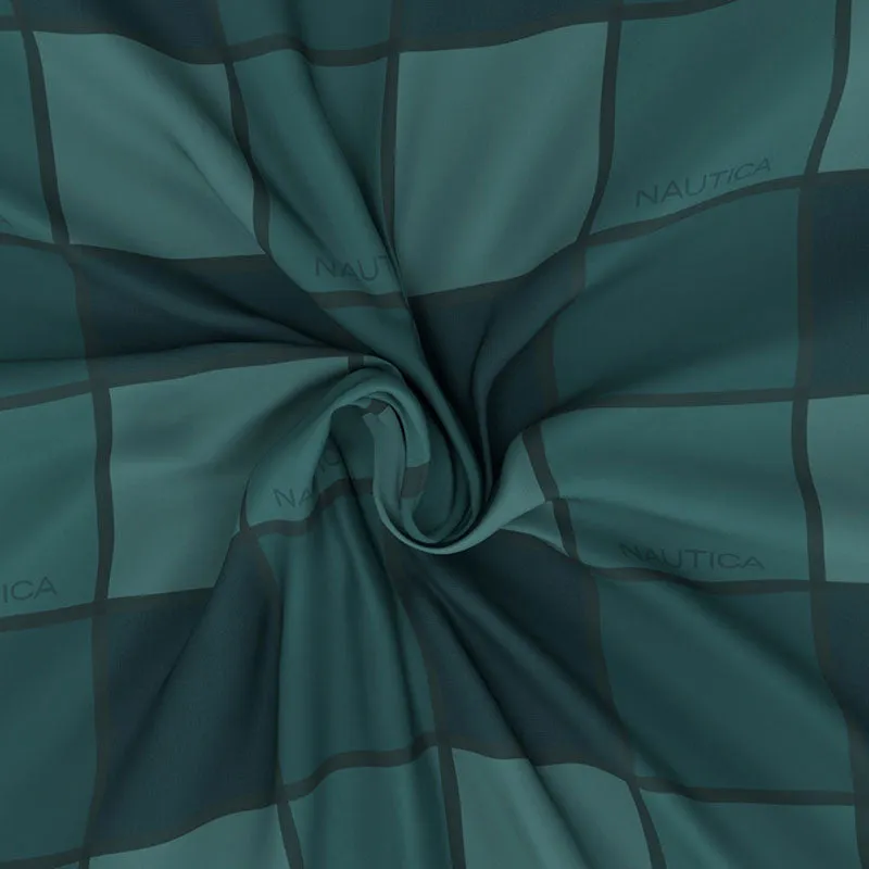 Green checked bedsheet fabric gathered to show its soft drape