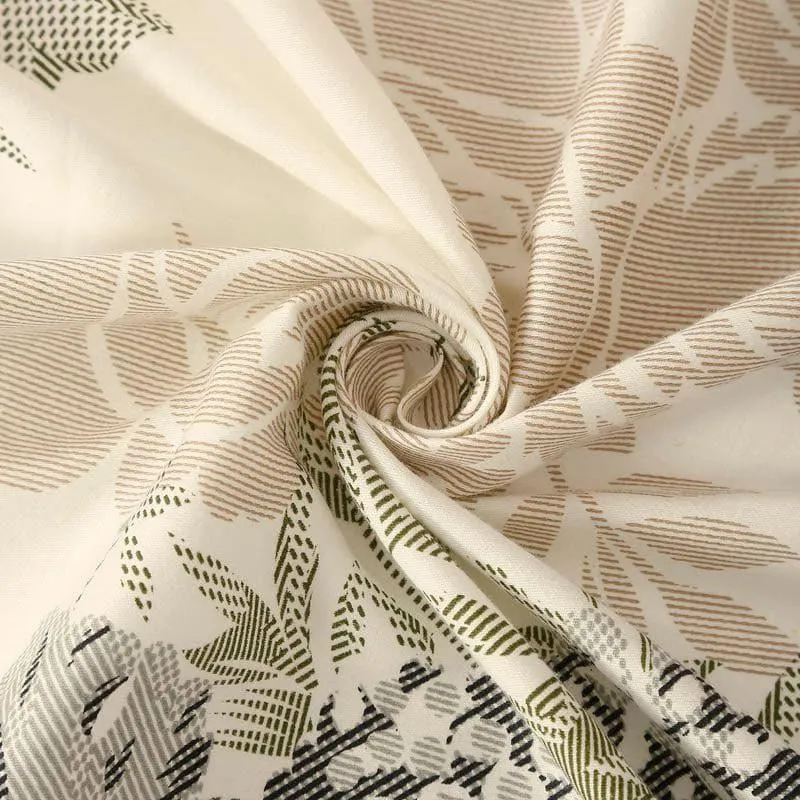 Close-up of cream bedsheet fabric with floral and leafy pattern