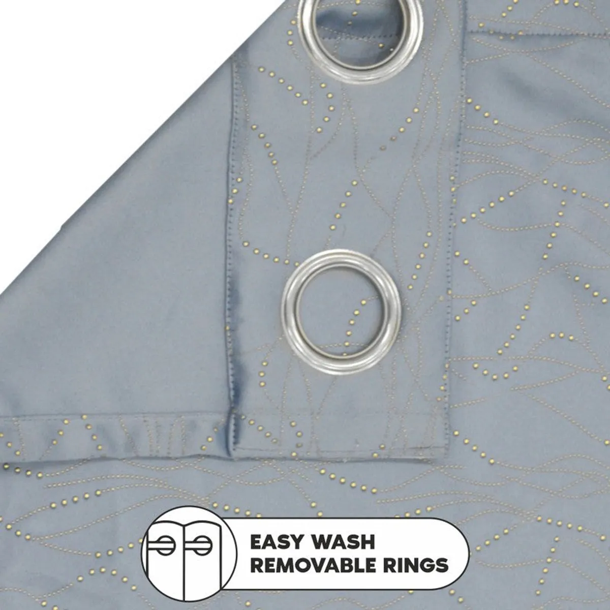 Close-up showing the curtain's silver eyelet rings and abstract pattern