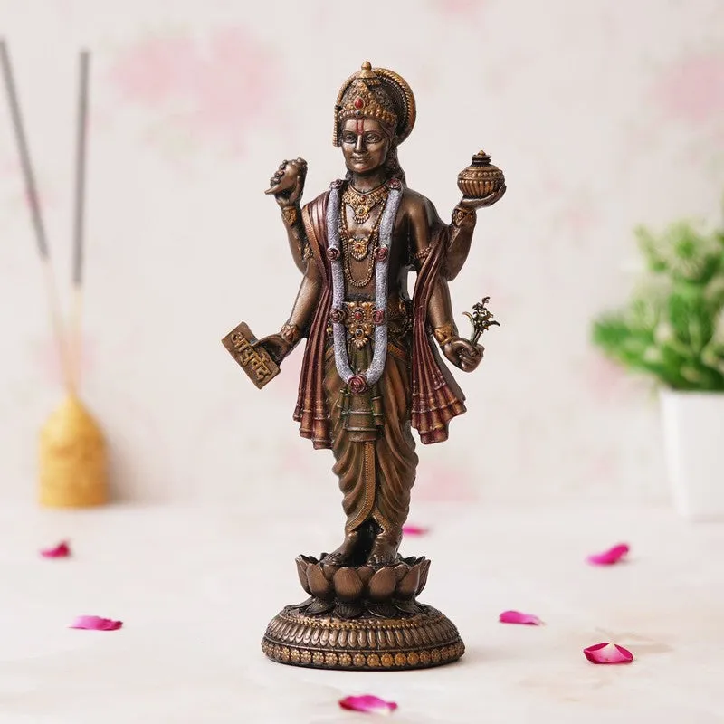 Bronze-toned Dhanvantari idol shown in a styled indoor setting
