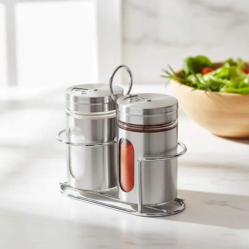Angled view of two silver spice jars in a matching stand.