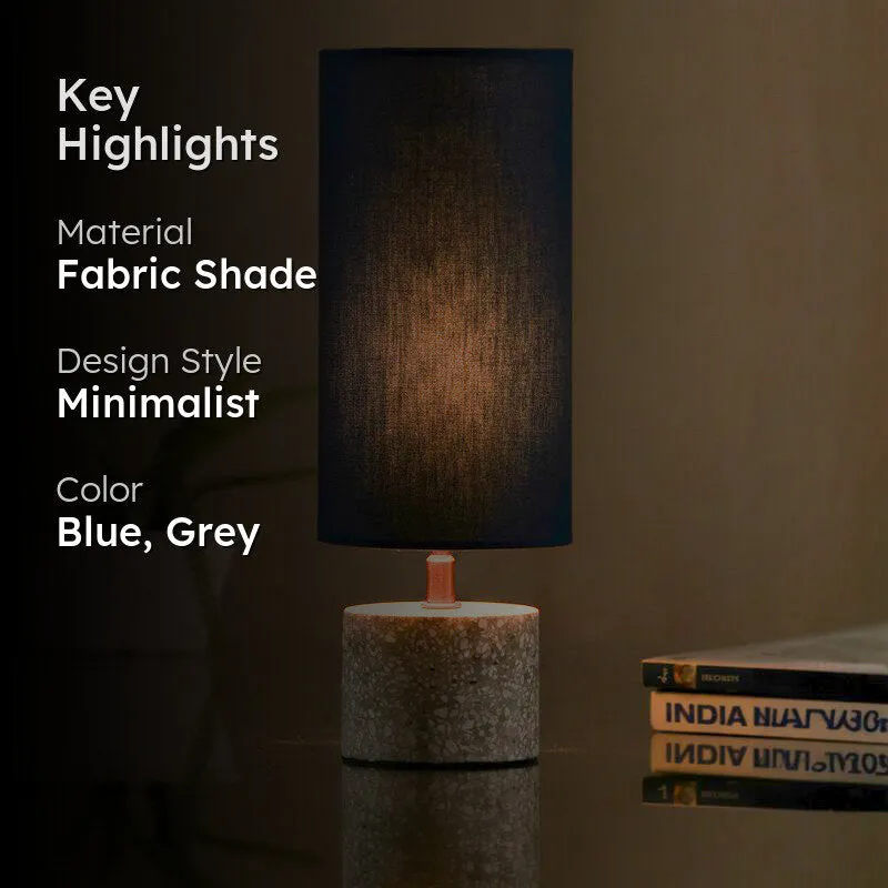 Blue table lamp lit up beside text highlights on a dark background