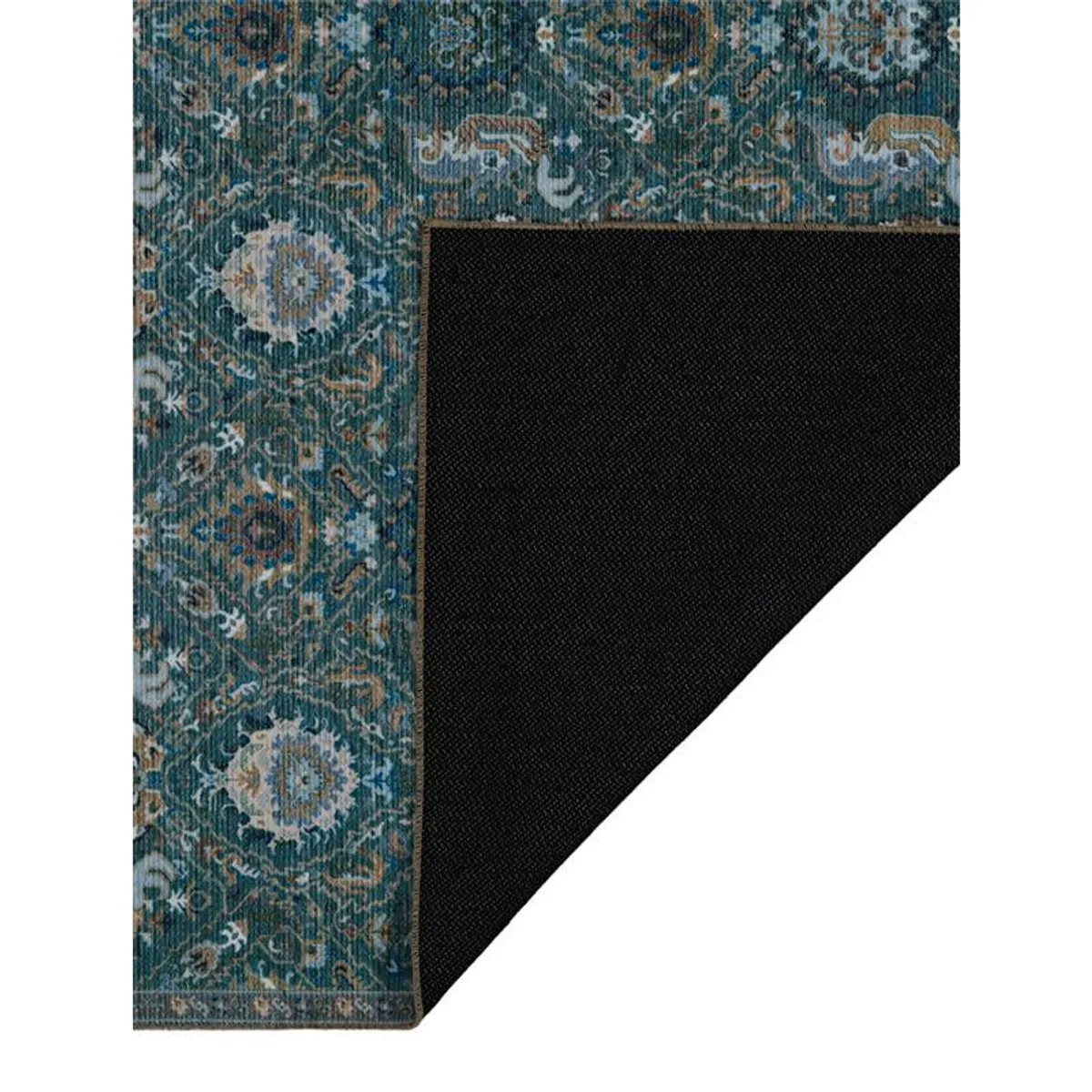 Underside corner of patterned carpet showing its dark backing and finished edge