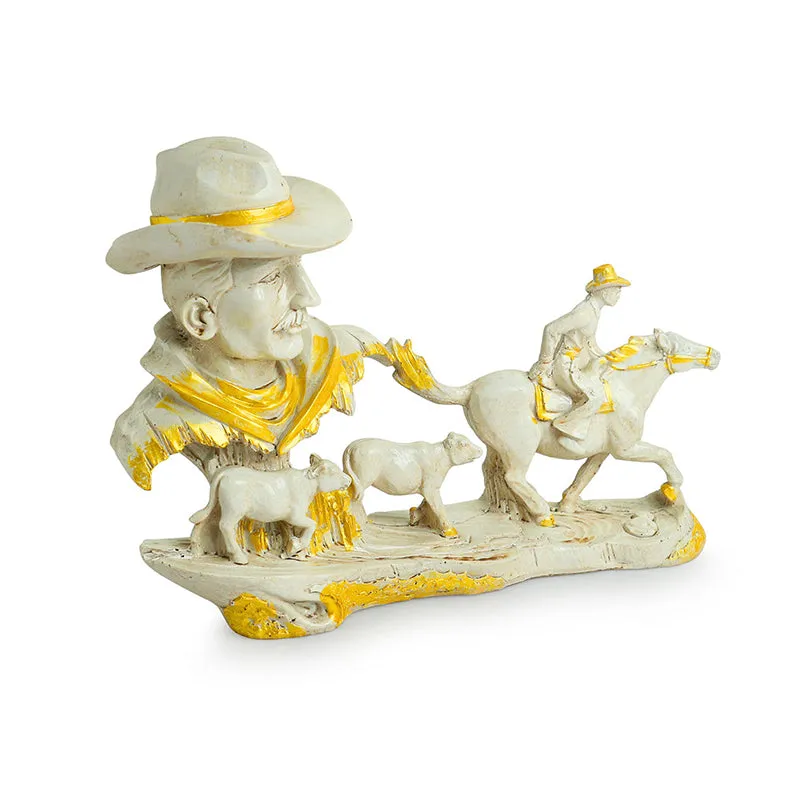 Front view of white and gold cowboy figurine showpiece with horse and cattle